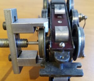 American Flyer O Gauge 3 Rail Engine. A large gap behind wheel to fit jaws.