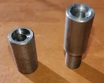 On one piece there is a 3/8" end & the other piece has a 1/2" end to fit the older Lionel style rivet presses